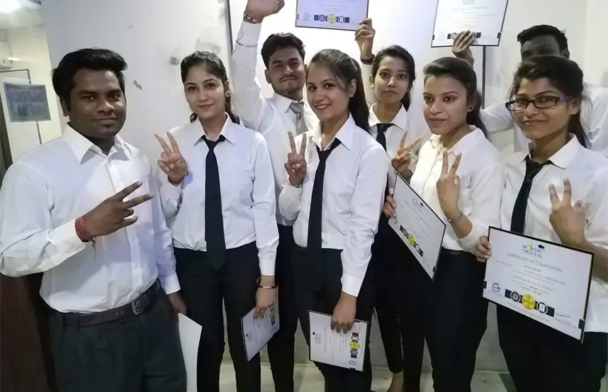 Students holding certificates after course completion at Oxford Software Institute