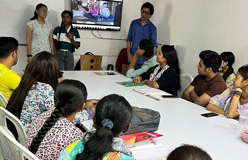 Students performing a roleplay activity at Oxford Software Institute